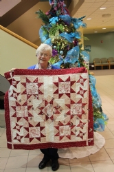 woman holding a quilt